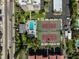 Overhead view of the community pool and tennis courts at 1001 Beach Rd # A203, Sarasota, FL 34242