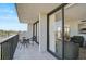 This spacious balcony features a dining area, perfect for enjoying an outdoor meal at 1001 Beach Rd # A203, Sarasota, FL 34242