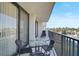 Enjoy serene treetop views from this private balcony with sliding glass doors at 1001 Beach Rd # A203, Sarasota, FL 34242