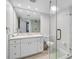 Modern bathroom with a glass-enclosed shower, spacious vanity, and ample lighting at 1001 Beach Rd # A203, Sarasota, FL 34242