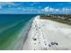 Stunning aerial view of the beach with white sand and clear turquoise water at 1001 Beach Rd # A203, Sarasota, FL 34242