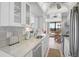 Modern kitchen featuring bright countertops, stainless steel appliances, and natural lighting at 1001 Beach Rd # A203, Sarasota, FL 34242