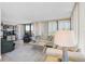 Bright and airy living room with comfortable seating, light wood floors, and natural light at 1001 Beach Rd # A203, Sarasota, FL 34242