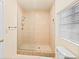 Bathroom featuring a glass-enclosed walk-in shower and window at 1011 68Th W Ave, Bradenton, FL 34207