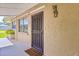 Inviting front entrance featuring a sturdy security door and decorative accent at 1011 68Th W Ave, Bradenton, FL 34207
