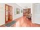 Inviting entryway featuring a wood door, tile floors, and views of the living area at 1011 68Th W Ave, Bradenton, FL 34207