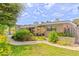 Charming single-story home featuring a manicured front yard with vibrant landscaping at 1011 68Th W Ave, Bradenton, FL 34207