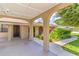 Covered carport featuring decorative columns and vibrant landscaping at 1011 68Th W Ave, Bradenton, FL 34207