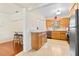 Open kitchen with ample counter space and a breakfast bar, seamlessly connected to the dining area at 1011 68Th W Ave, Bradenton, FL 34207