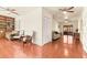 Open living area with tile flooring, built-in bookshelves, and comfortable seating at 1011 68Th W Ave, Bradenton, FL 34207