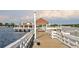Picturesque pier featuring a covered gazebo-style structure and seating along the waterfront at 1011 68Th W Ave, Bradenton, FL 34207