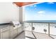 Outdoor balcony with ocean views, a built-in grill, and stunning beach scenery at 1035 Seaside Dr # 603, Sarasota, FL 34242