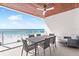 Relaxing balcony with stylish dining set, offering stunning ocean views and a peaceful atmosphere at 1035 Seaside Dr # 603, Sarasota, FL 34242