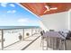 Expansive balcony with ocean views, outdoor seating, and relaxing beachside scenery at 1035 Seaside Dr # 603, Sarasota, FL 34242