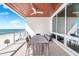 Spacious balcony featuring a dining set and ocean views, perfect for outdoor entertaining at 1035 Seaside Dr # 603, Sarasota, FL 34242