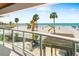Breathtaking balcony view of the sandy beach and blue ocean waters at 1035 Seaside Dr # 603, Sarasota, FL 34242