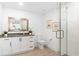 Bathroom featuring vanity with stone countertop, toilet, and glass walk-in shower at 1035 Seaside Dr # 603, Sarasota, FL 34242