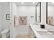 Modern bathroom with a double sink vanity, sleek mirrors, and elegant fixtures at 1035 Seaside Dr # 603, Sarasota, FL 34242