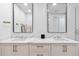 Modern bathroom with a double sink vanity, sleek mirrors, and elegant fixtures at 1035 Seaside Dr # 603, Sarasota, FL 34242