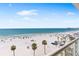 Breathtaking ocean view from a balcony showcasing the beach and clear blue sky at 1035 Seaside Dr # 603, Sarasota, FL 34242