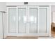 Bedroom features opaque glass sliding doors for privacy at 1035 Seaside Dr # 603, Sarasota, FL 34242
