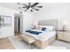 Bright bedroom with a luxurious bed, side tables, and a walk-in closet at 1035 Seaside Dr # 603, Sarasota, FL 34242