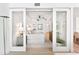 Bright bedroom featuring sliding glass doors, ceiling fan, and tranquil beach views at 1035 Seaside Dr # 603, Sarasota, FL 34242