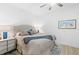 Comfortable bedroom with a cozy bed, side table, and tasteful decor, perfect for relaxation at 1035 Seaside Dr # 603, Sarasota, FL 34242