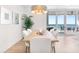 Dining room with ocean views and seating for six, adjacent to balcony at 1035 Seaside Dr # 603, Sarasota, FL 34242