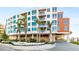 Modern condominium building with covered parking, lush landscaping, and convenient beach access at 1035 Seaside Dr # 603, Sarasota, FL 34242