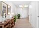 Bright hallway featuring modern decor, hardwood floors, and a stylish chandelier at 1035 Seaside Dr # 603, Sarasota, FL 34242