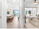Open-concept interior with a kitchen, living area, and Primary bedroom showcasing seamless flow and modern design at 1035 Seaside Dr # 603, Sarasota, FL 34242