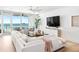 Bright and airy living room with modern furniture and stunning ocean views at 1035 Seaside Dr # 603, Sarasota, FL 34242