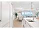 Bright interior featuring an open layout with a dining area and ocean views at 1035 Seaside Dr # 603, Sarasota, FL 34242