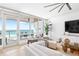 Bright living room boasts a large sectional sofa, stylish decor, and scenic ocean views at 1035 Seaside Dr # 603, Sarasota, FL 34242