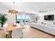 Open-concept living area with dining space and stunning ocean views at 1035 Seaside Dr # 603, Sarasota, FL 34242