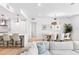 Open living space with kitchen island, dining area, and modern decor at 1035 Seaside Dr # 603, Sarasota, FL 34242