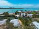 Beautiful aerial view of the home with backyard pool and dock, located on a waterfront property with city views at 110 Faubel St, Sarasota, FL 34242