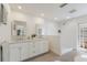 Bathroom featuring a double vanity with white cabinetry and a separate shower area at 110 Faubel St, Sarasota, FL 34242