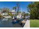 Waterfront home featuring a boat dock with a boat lift and direct access to the canal at 110 Faubel St, Sarasota, FL 34242