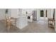 Bright, updated kitchen featuring stainless steel appliances and an island, leading to the outdoor area at 110 Faubel St, Sarasota, FL 34242
