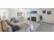 Open-concept living room with fireplace, and modern furniture for entertaining and relaxing at 110 Faubel St, Sarasota, FL 34242