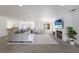Spacious and bright living room featuring a fireplace, modern furniture, and access to the backyard at 110 Faubel St, Sarasota, FL 34242