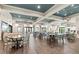 Large dining area with wood floors, modern decor, and lots of natural light at 11127 Devonbridge Dr, Palmetto, FL 34221