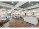 Beautiful dining area with ample seating, modern lighting fixtures, and light-filled space at 11127 Devonbridge Dr, Palmetto, FL 34221
