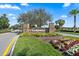 Community entrance sign surrounded by colorful landscaping at 11127 Devonbridge Dr, Palmetto, FL 34221