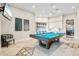 Charming game room with a pool table, decorative tile floor, and a cozy atmosphere at 11127 Devonbridge Dr, Palmetto, FL 34221