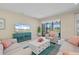 Bright living room with stylish furniture and large glass sliding doors to outside patio at 11127 Devonbridge Dr, Palmetto, FL 34221