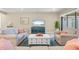 Comfortable living room with tile floors, neutral furniture and view of the backyard at 11127 Devonbridge Dr, Palmetto, FL 34221