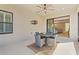 Covered patio offers a ceiling fan and access to the main living area at 11127 Devonbridge Dr, Palmetto, FL 34221